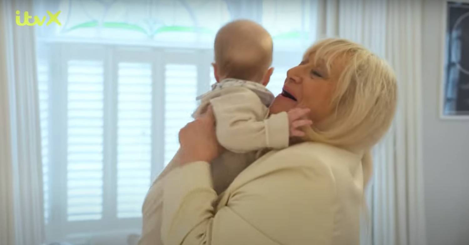 Judy Finnigan hugs Bodhi
