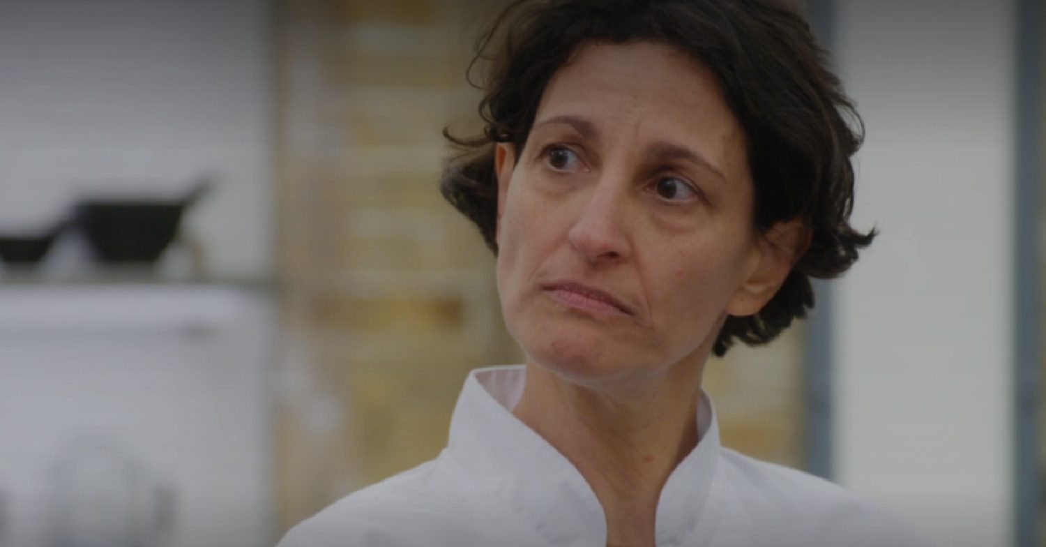 Cristina Maia listens to the judges criticism on MasterChef