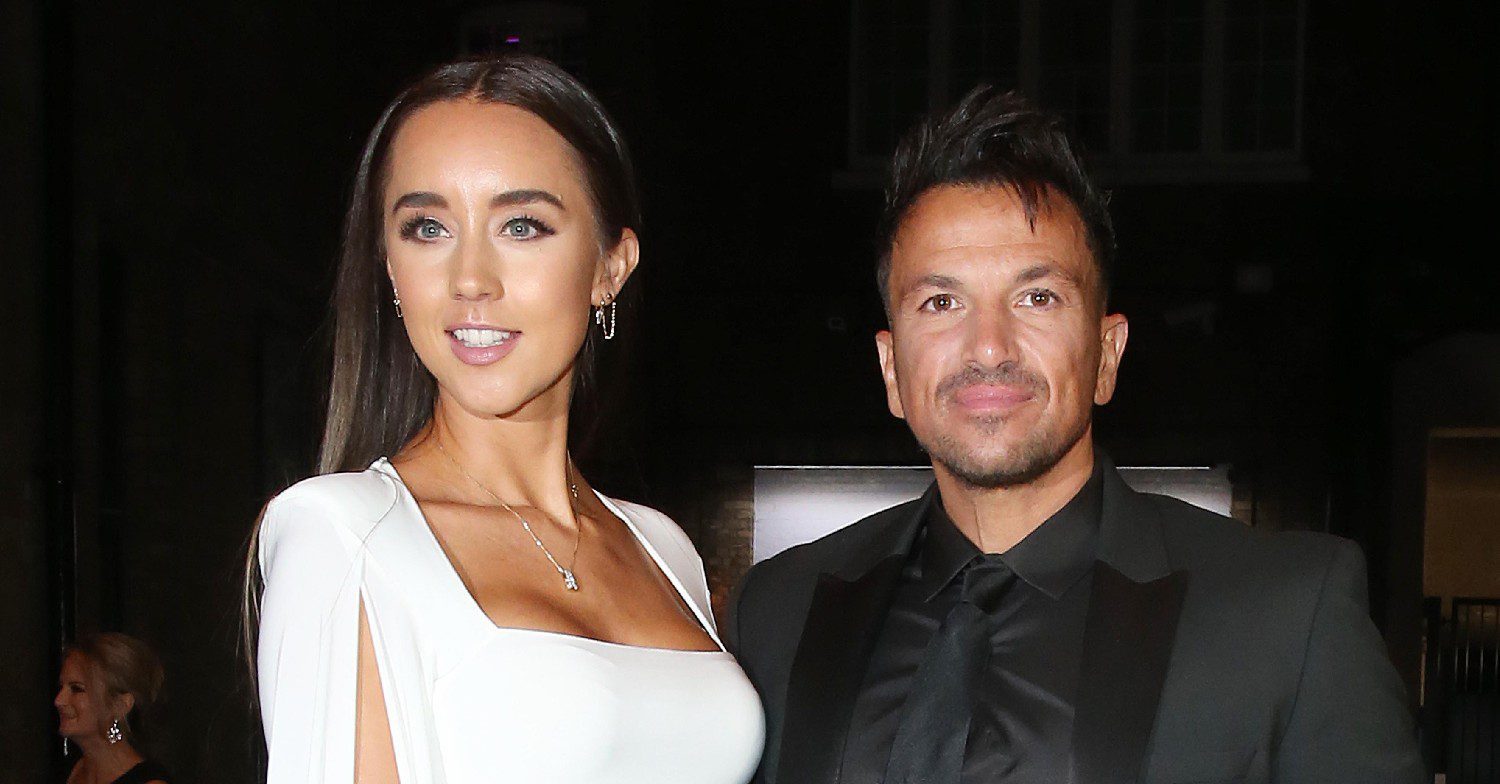 Peter Andre and wife Emily smiling at event