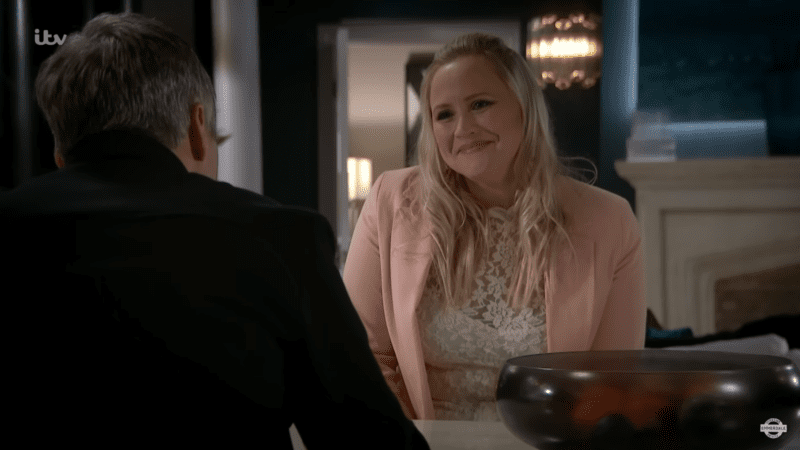 Tracy Metcalfe smiles at Caleb Milligan during their business meeting