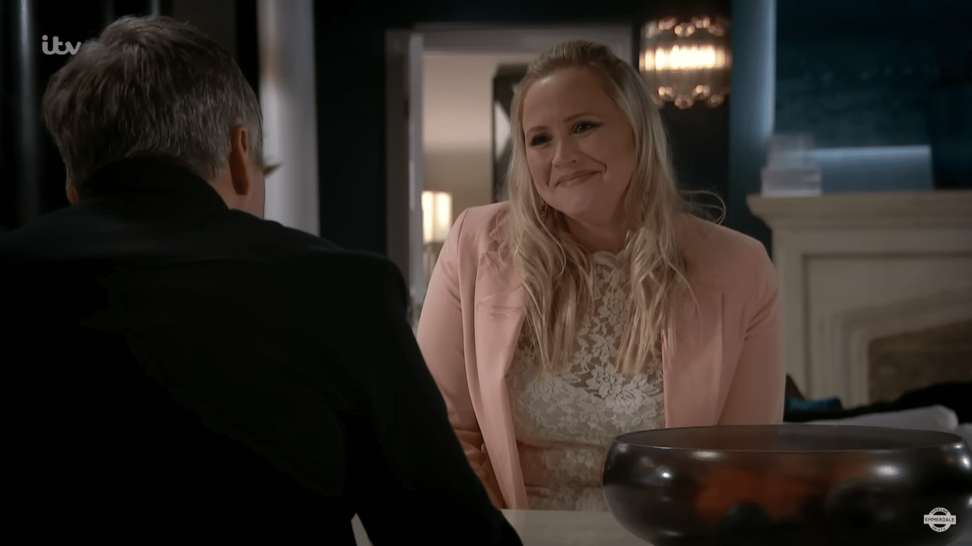 Tracy Metcalfe smiles at Caleb Milligan during their business meeting