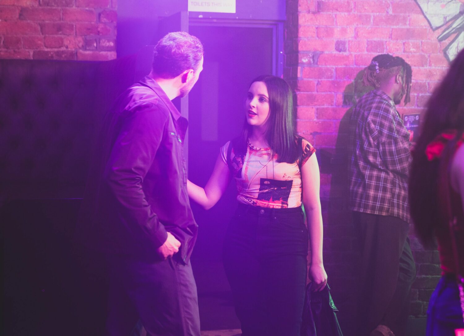 Coronation Street's Amy is talking to a guy called Dan at the club