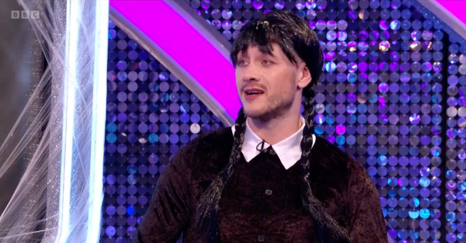 Kevin Clifton dressed as Wednesday Addams while appearing on a spooky special of Strictly: It Takes Two