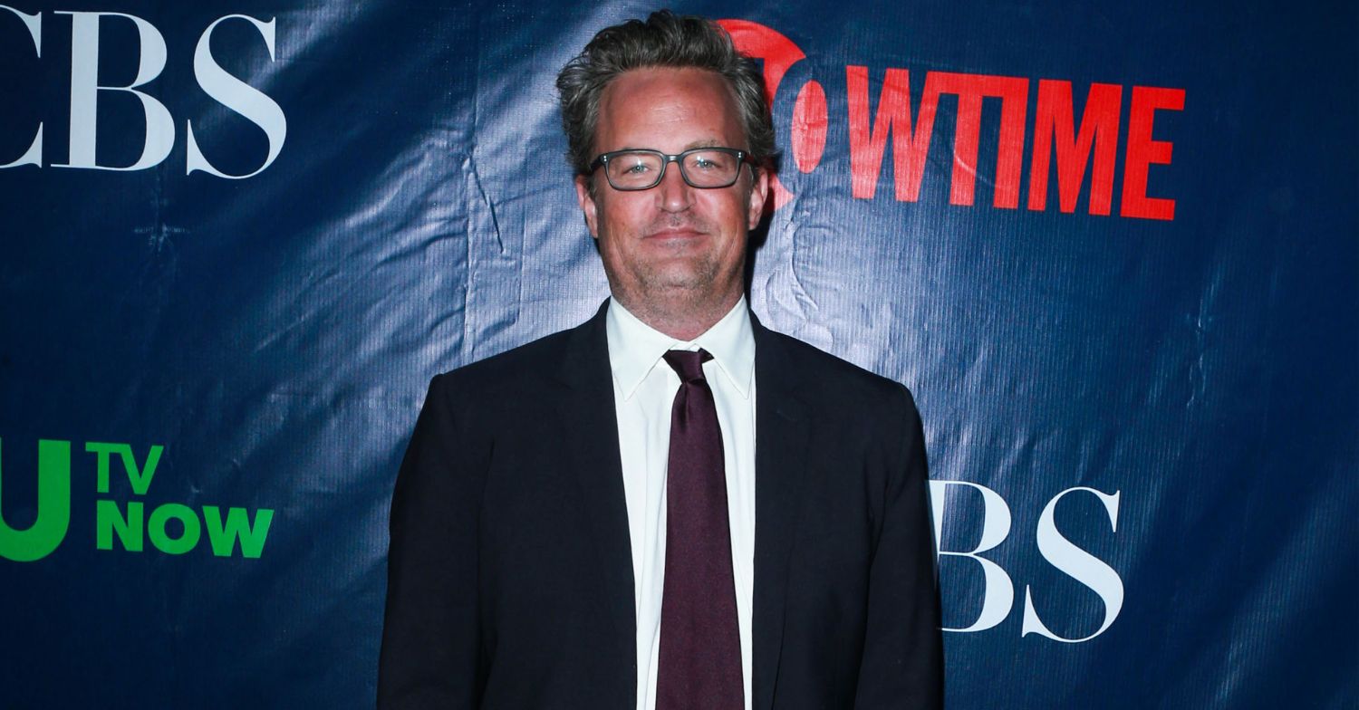 Matthew Perry smiling on the red carpet