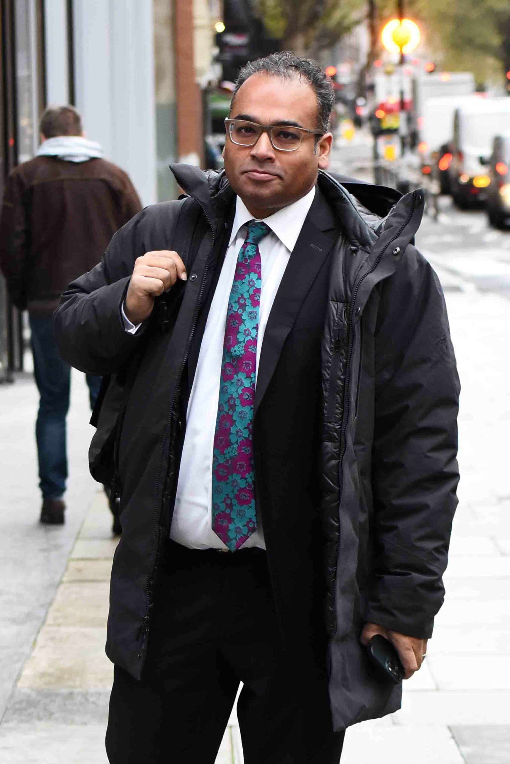 Krishnan Guru-Murthy photographed in the street