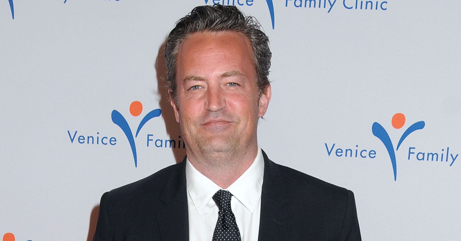 Matthew Perry smiling on the red carpet