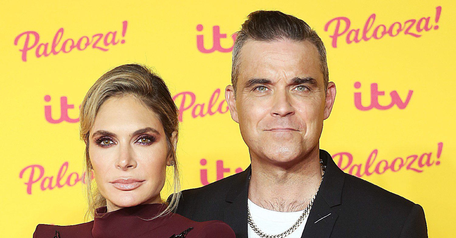 Robbie Williams and his wife smiling