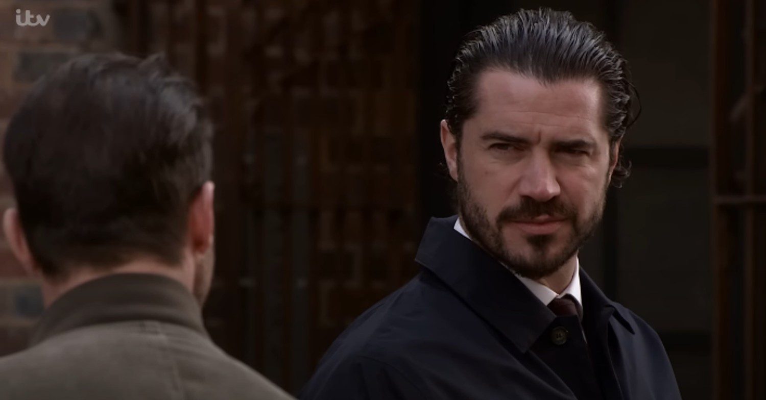 Adam glaring at Damon on Corrie