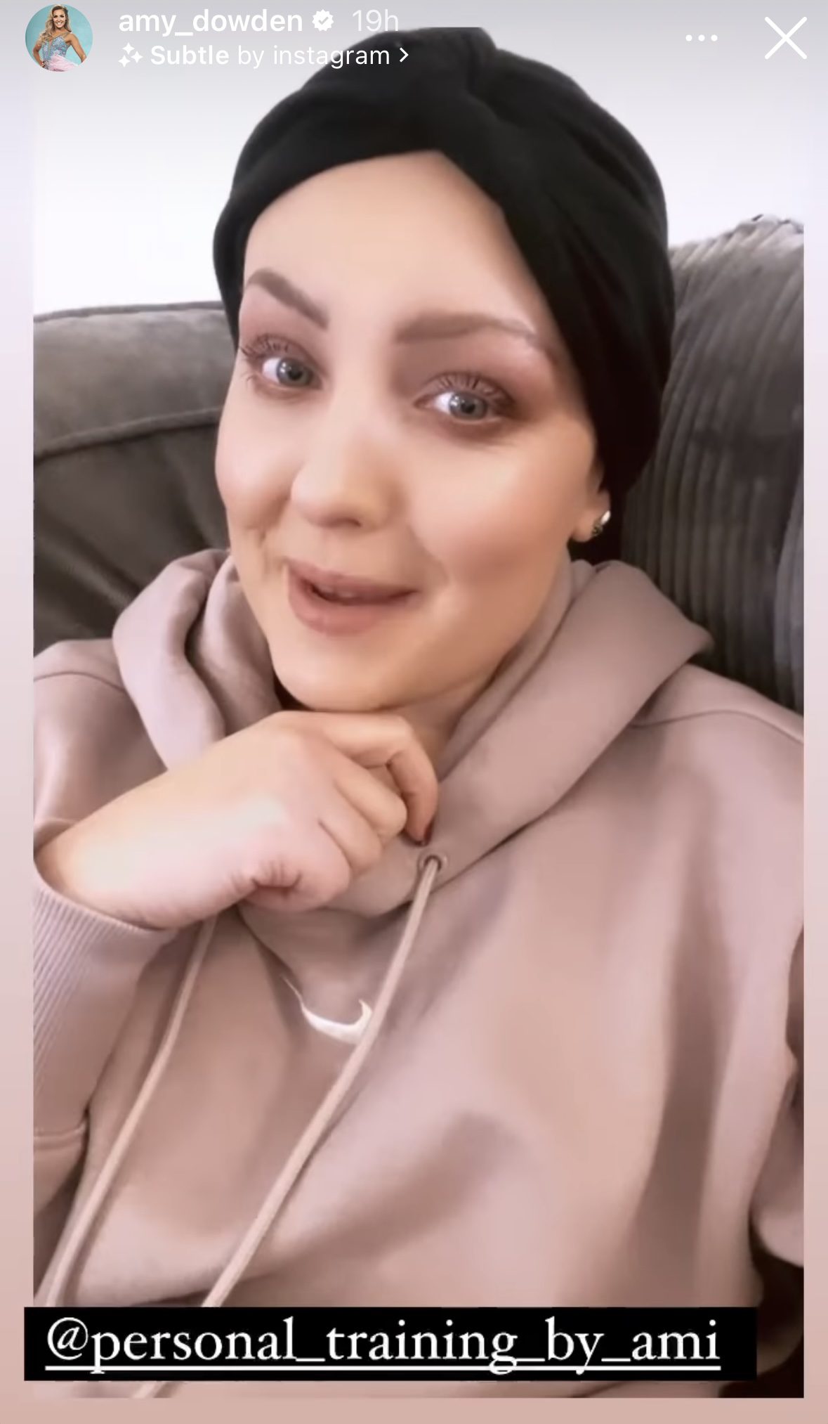 Amy Dowden smiling wearing a head scarf