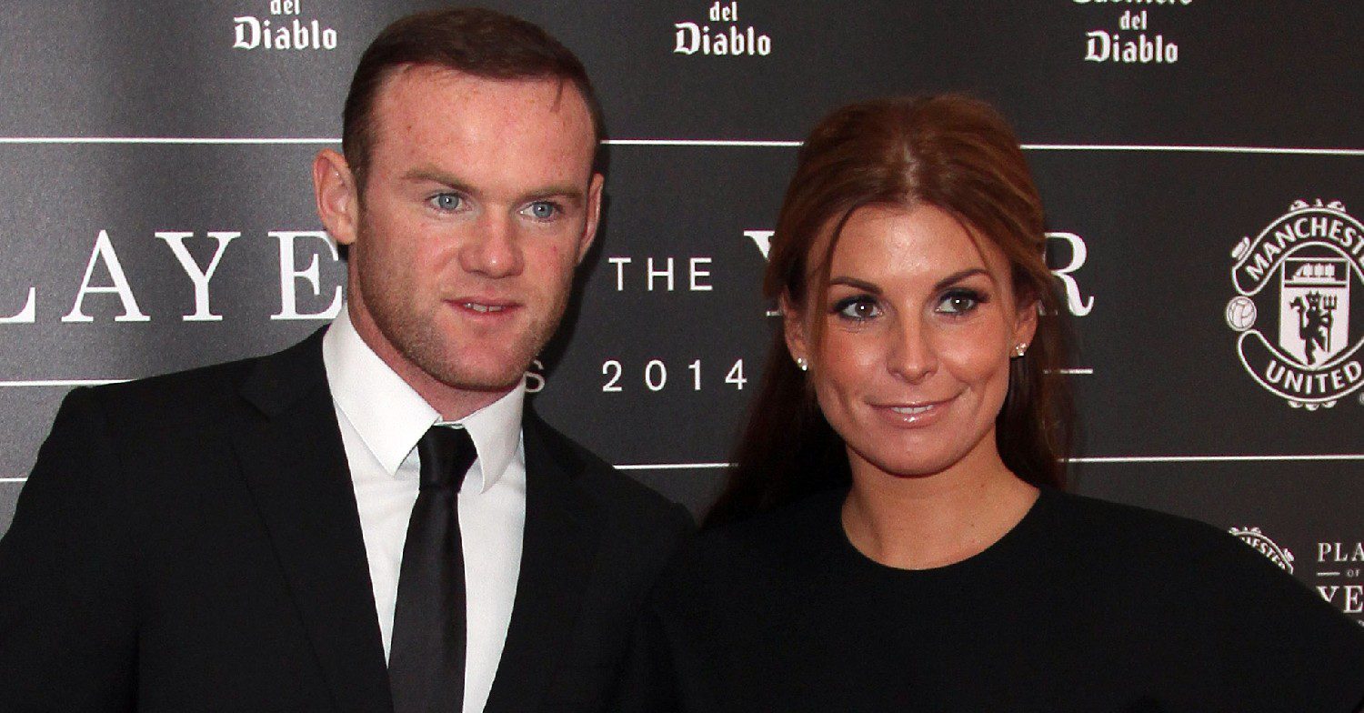Wayne and Coleen Rooney smiling at an event