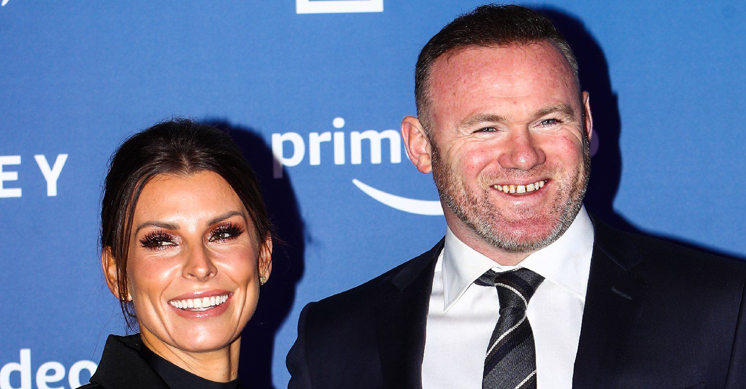 Wayne and Coleen Rooney smiling at an event