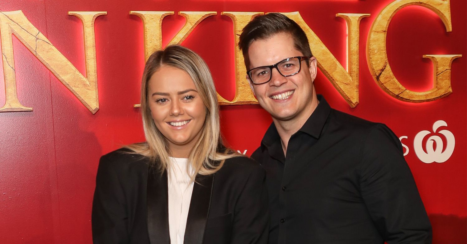 Johnny Ruffo and Tahnee Sims smiling on the red carpet