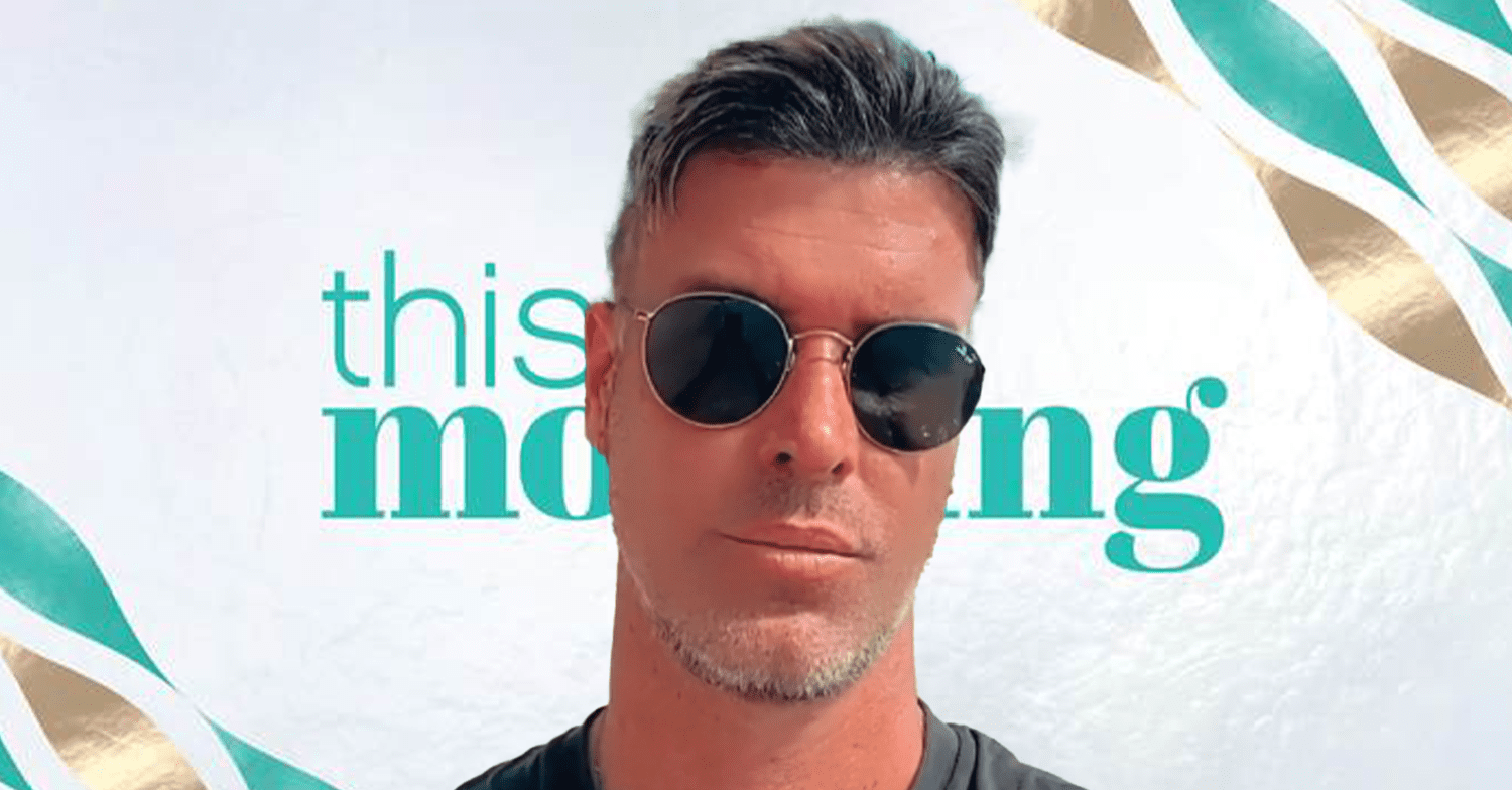 Harry Bott wearing sunglasses in front of the This Morning logo