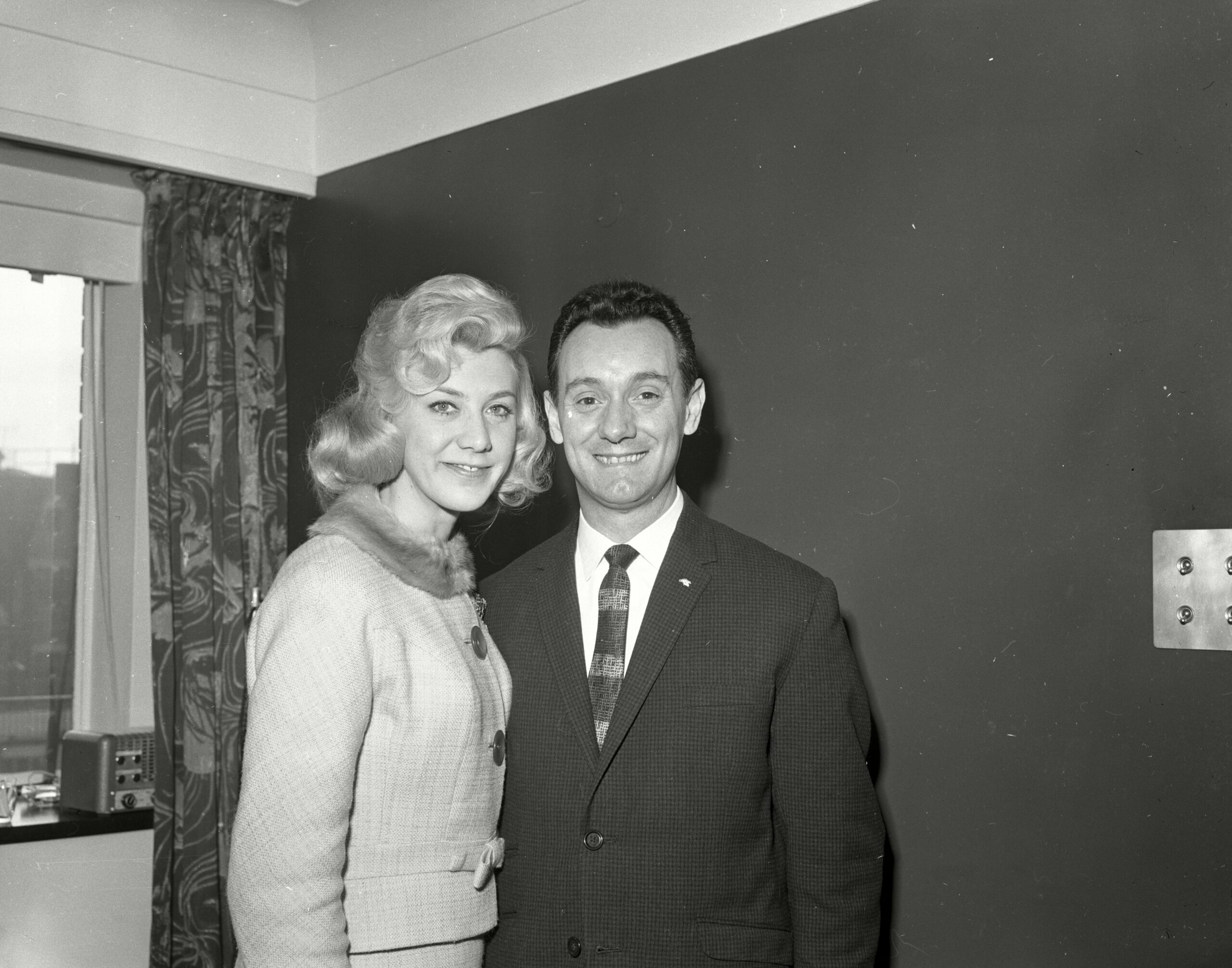 Joan Savage is smiling alongside Ken Morris