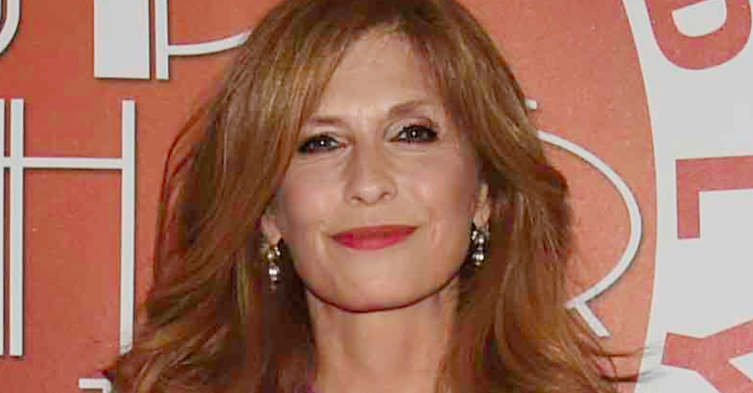 Emmerdale's Samantha Giles is smiling at a charity event