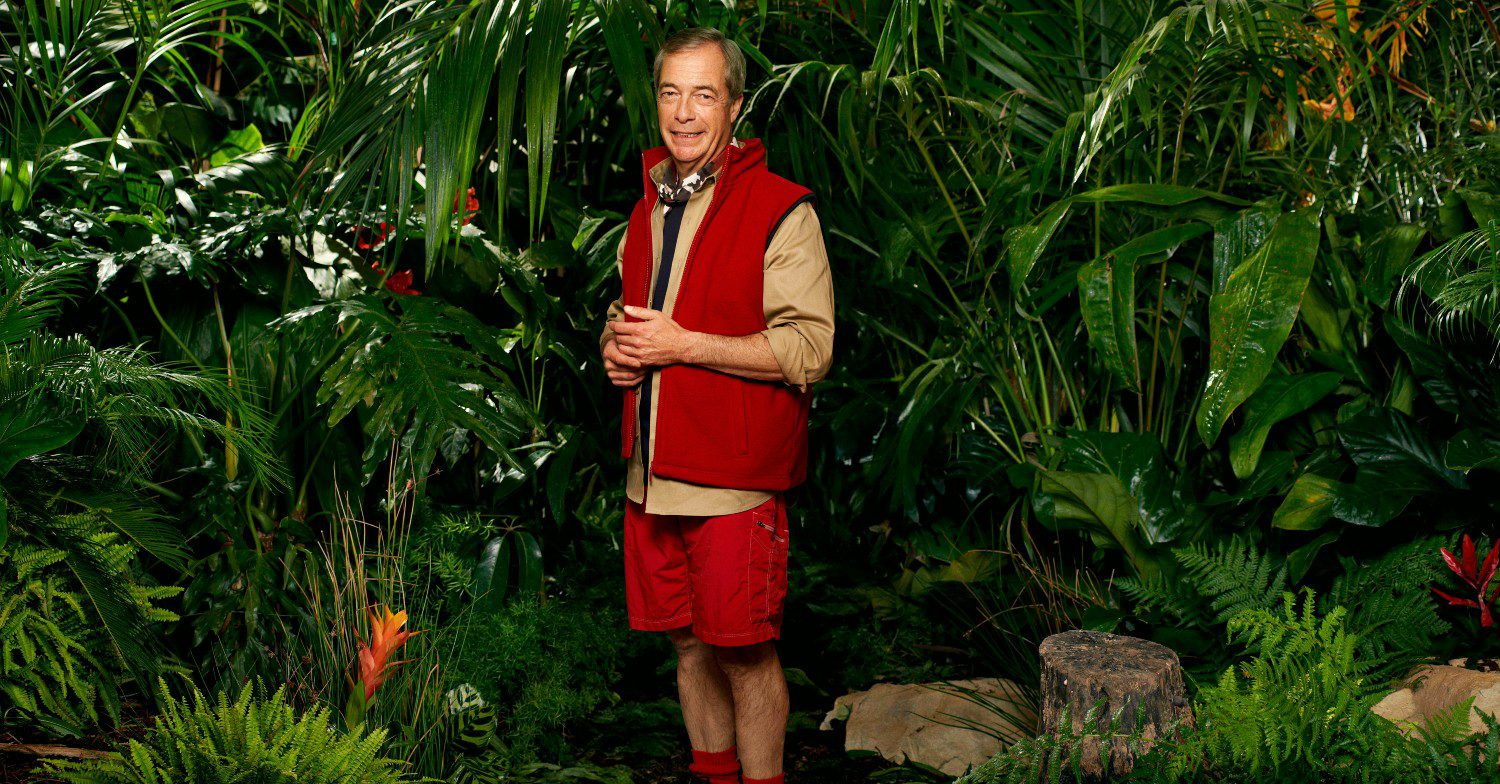 Former politician Nigel Farage stood in front of a jungle background