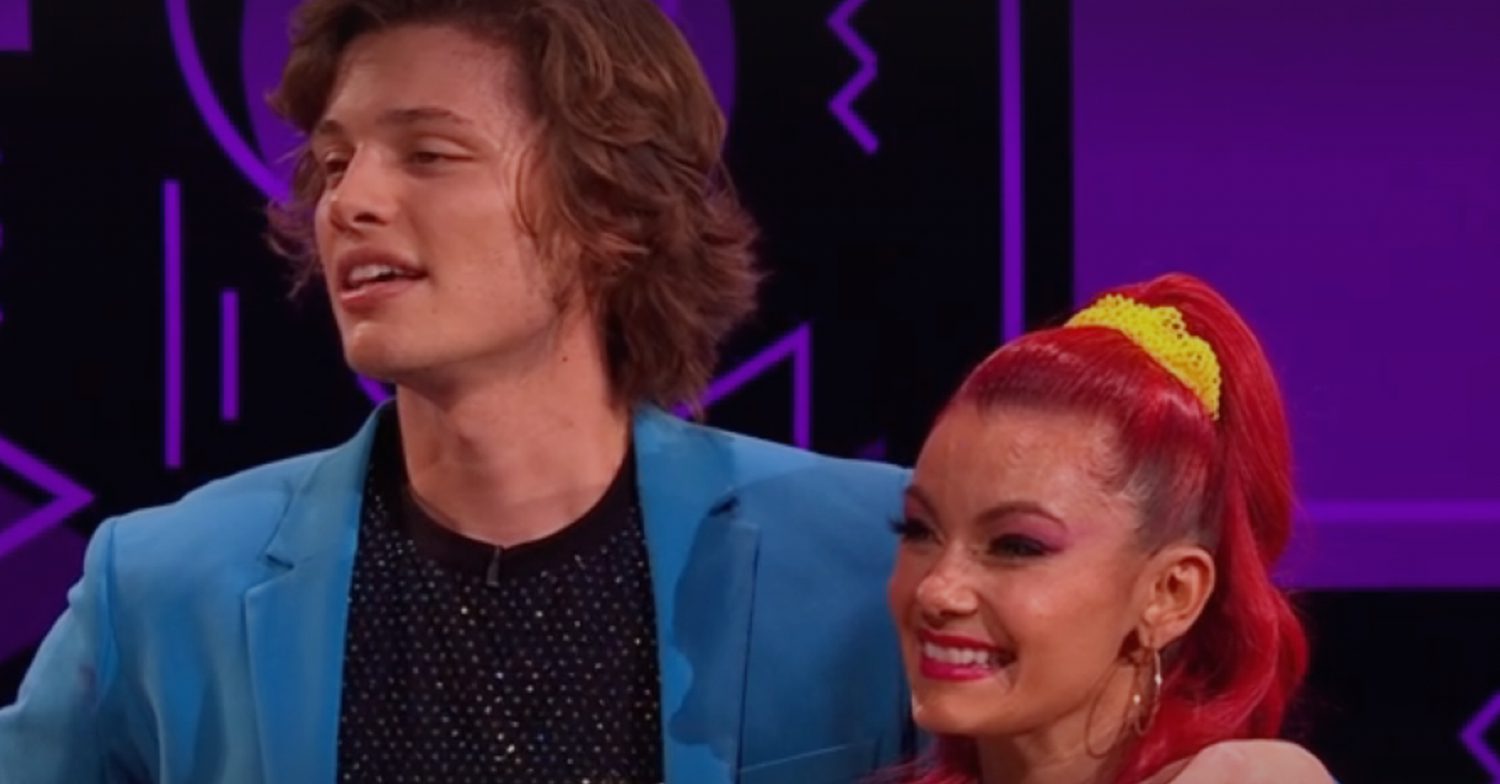 Bobby Brazier and Dianne Buswell listen attentively to the judges remarks