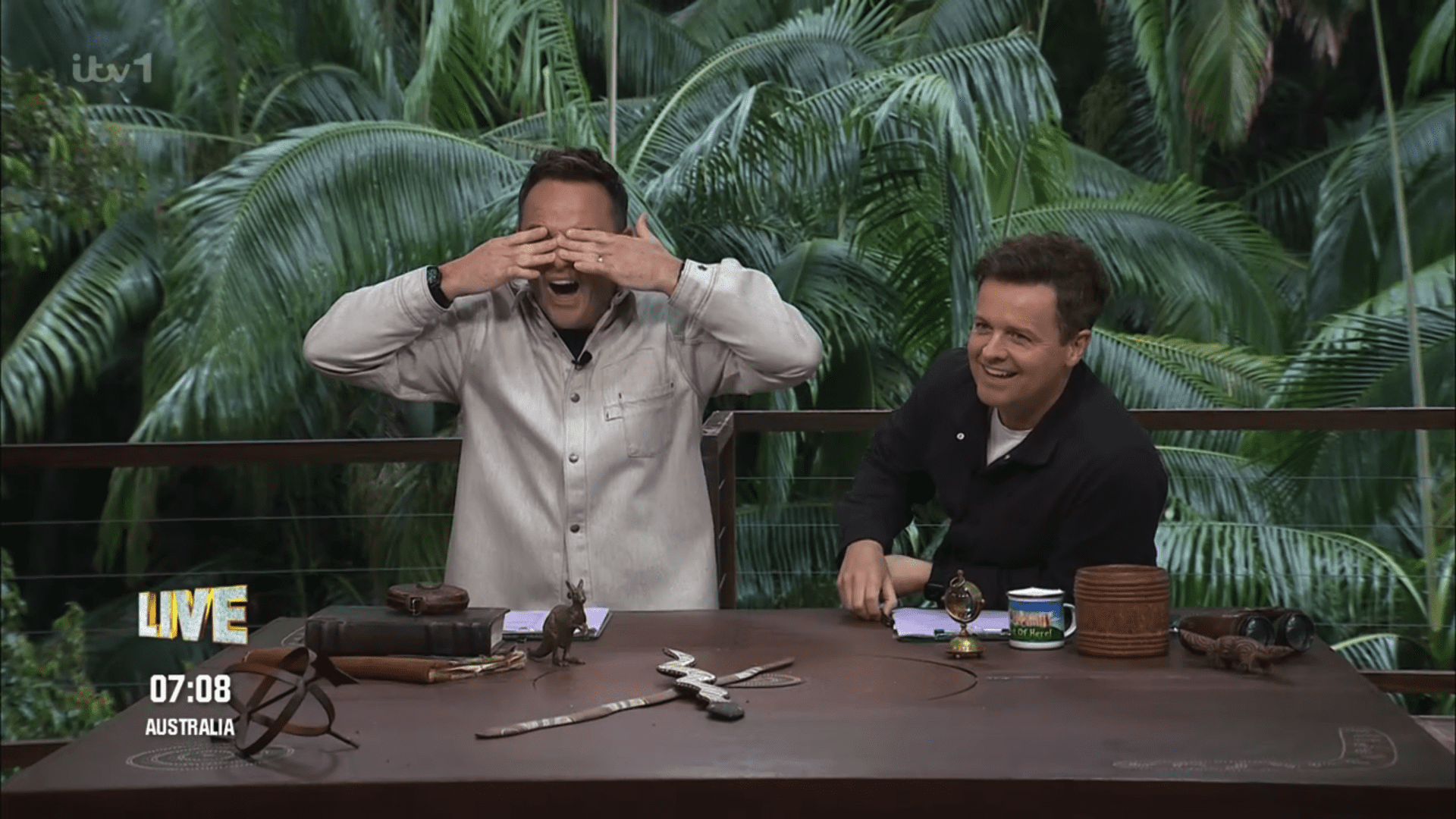 Ant McPartlin covering his eyes and Dec laughing