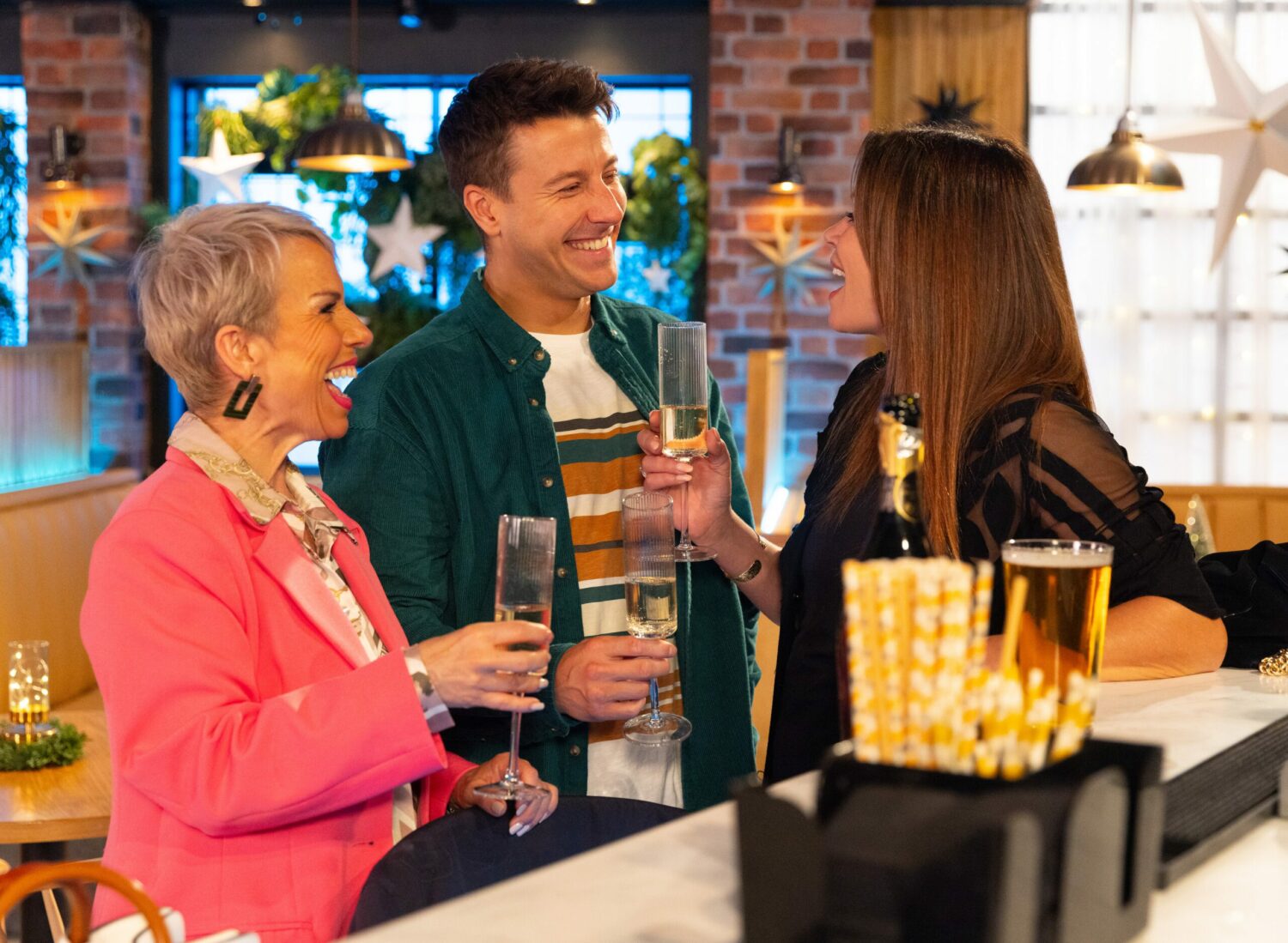 Coronation Street's Debbie, Ryan and Carla are laughing in the Bistro