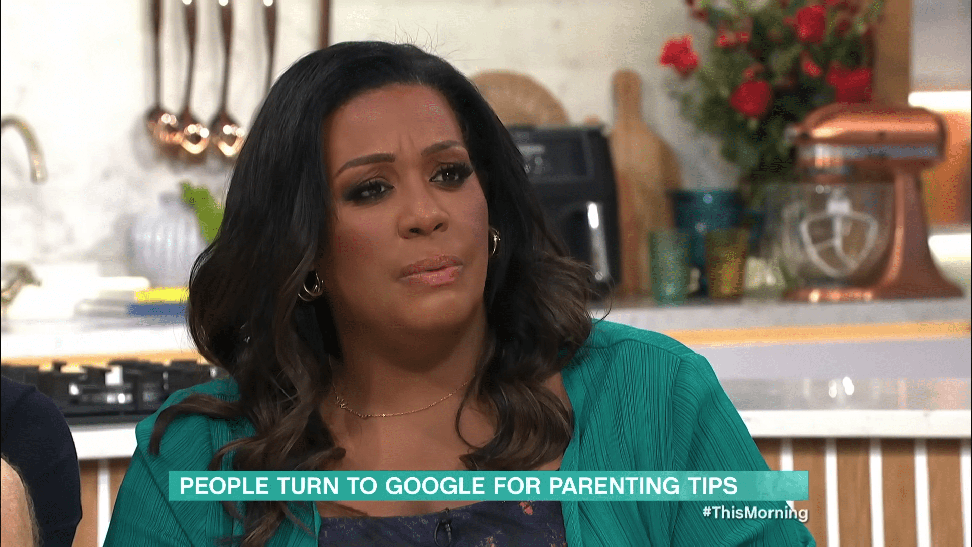 Alison Hammond speaking on This Morning in a green top