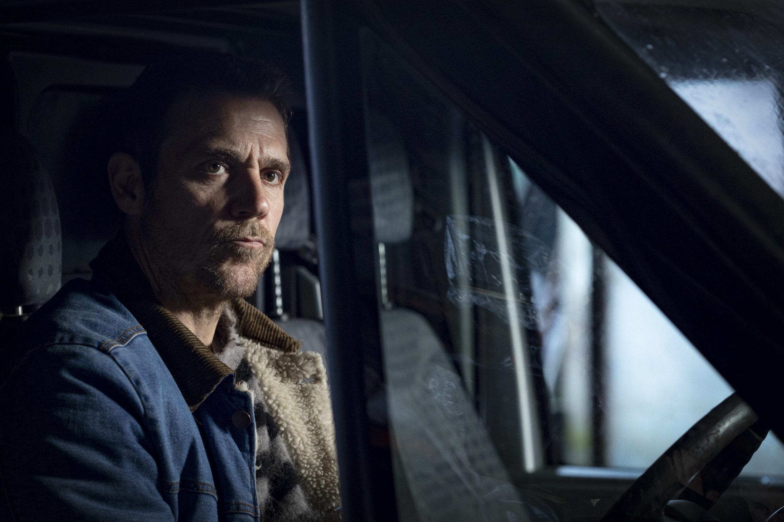 Cal sitting in his silver van in Shetland