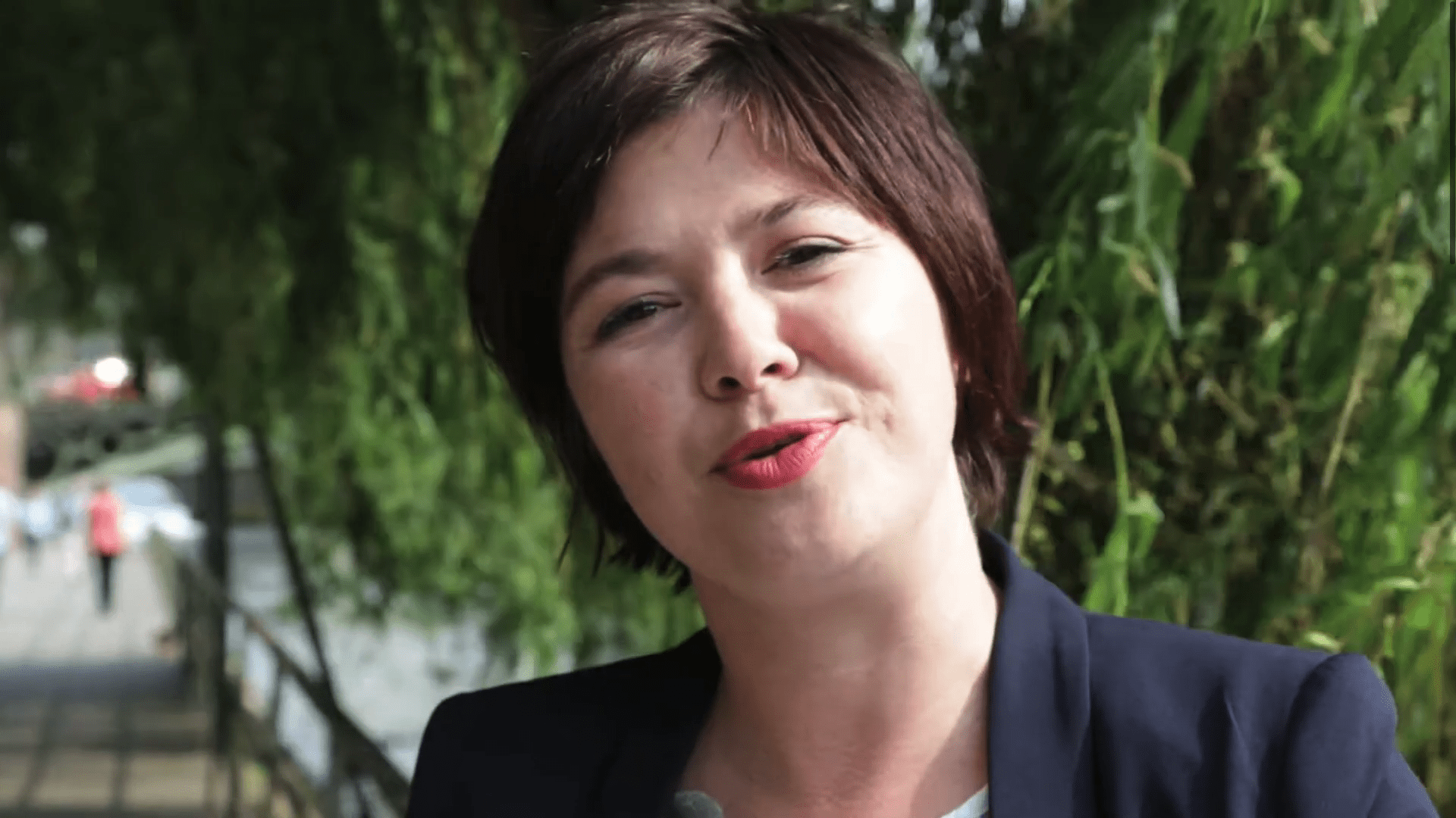 Laure Ferrari smiling wearing red lipstick