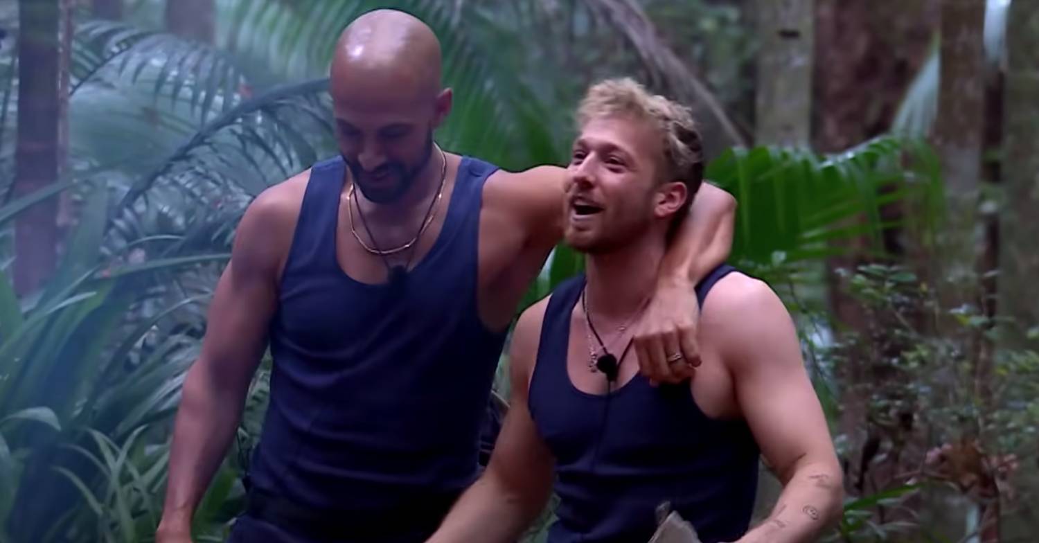 Marvin Humes puts an arm around Sam Thompson on I'm A Celeb