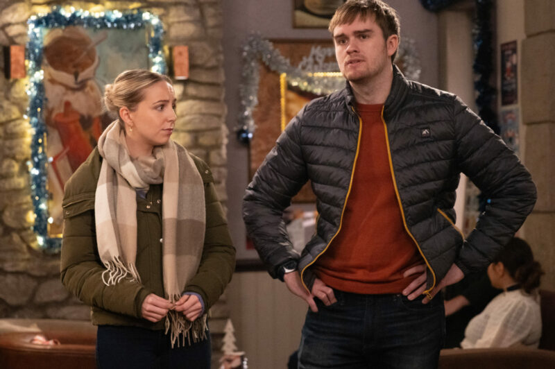 Tom and Belle looking awkward on Emmerdale