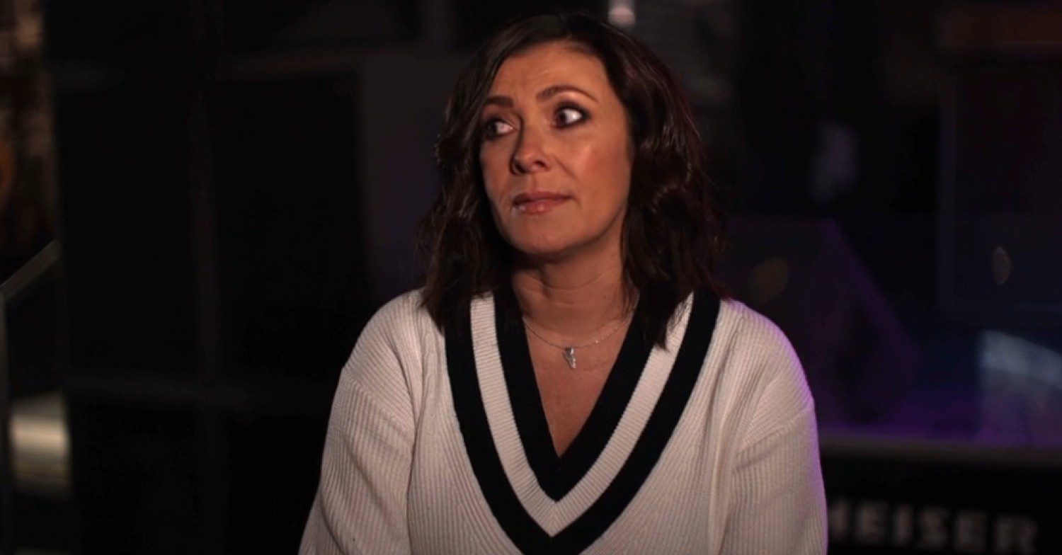 Kym looking upset in a video clip