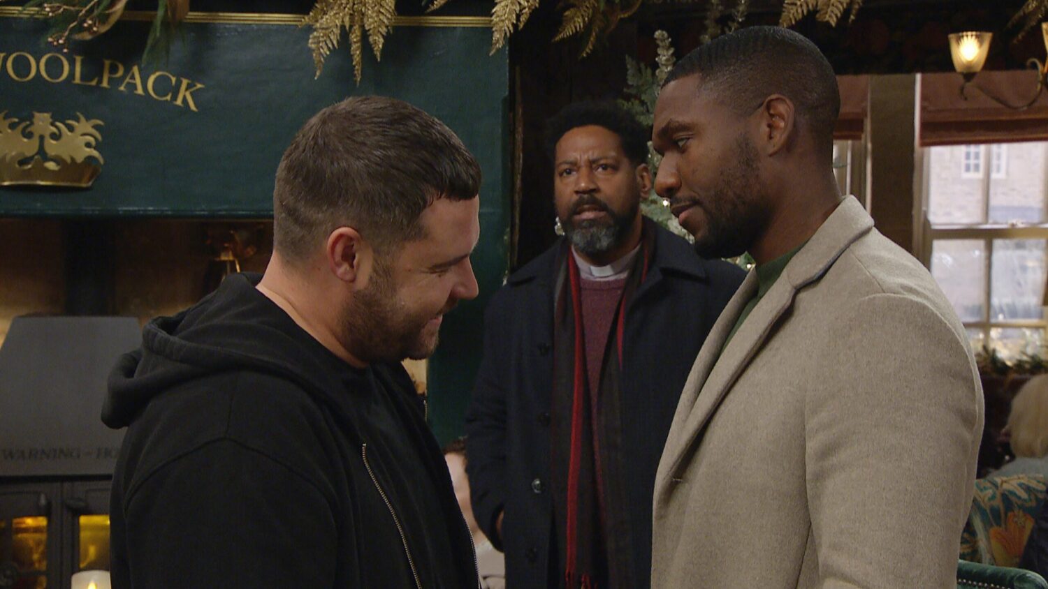 Emmerdale's Aaron is talking to Ethan in the Woolpack as Charles looks on