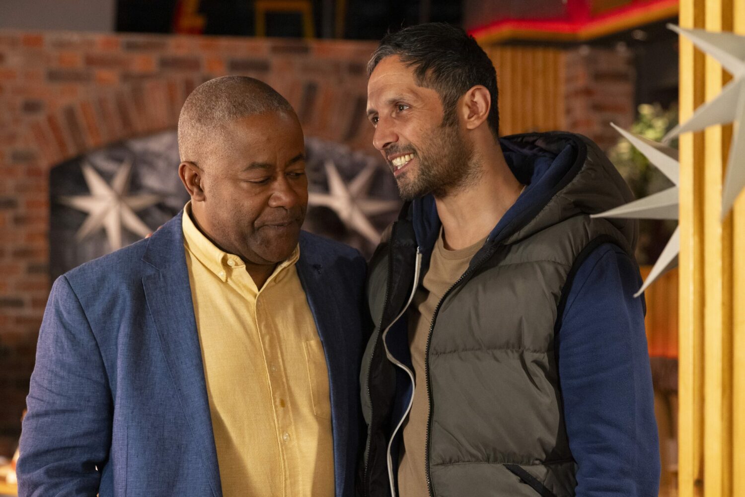 Ed in Corrie looks worried as Tony threatens him with a smile on his face.