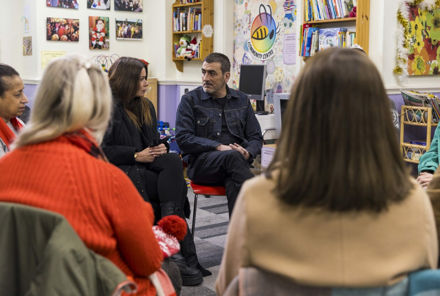 Carla Connor and Peter Barlow look seriously at each other at his support group
