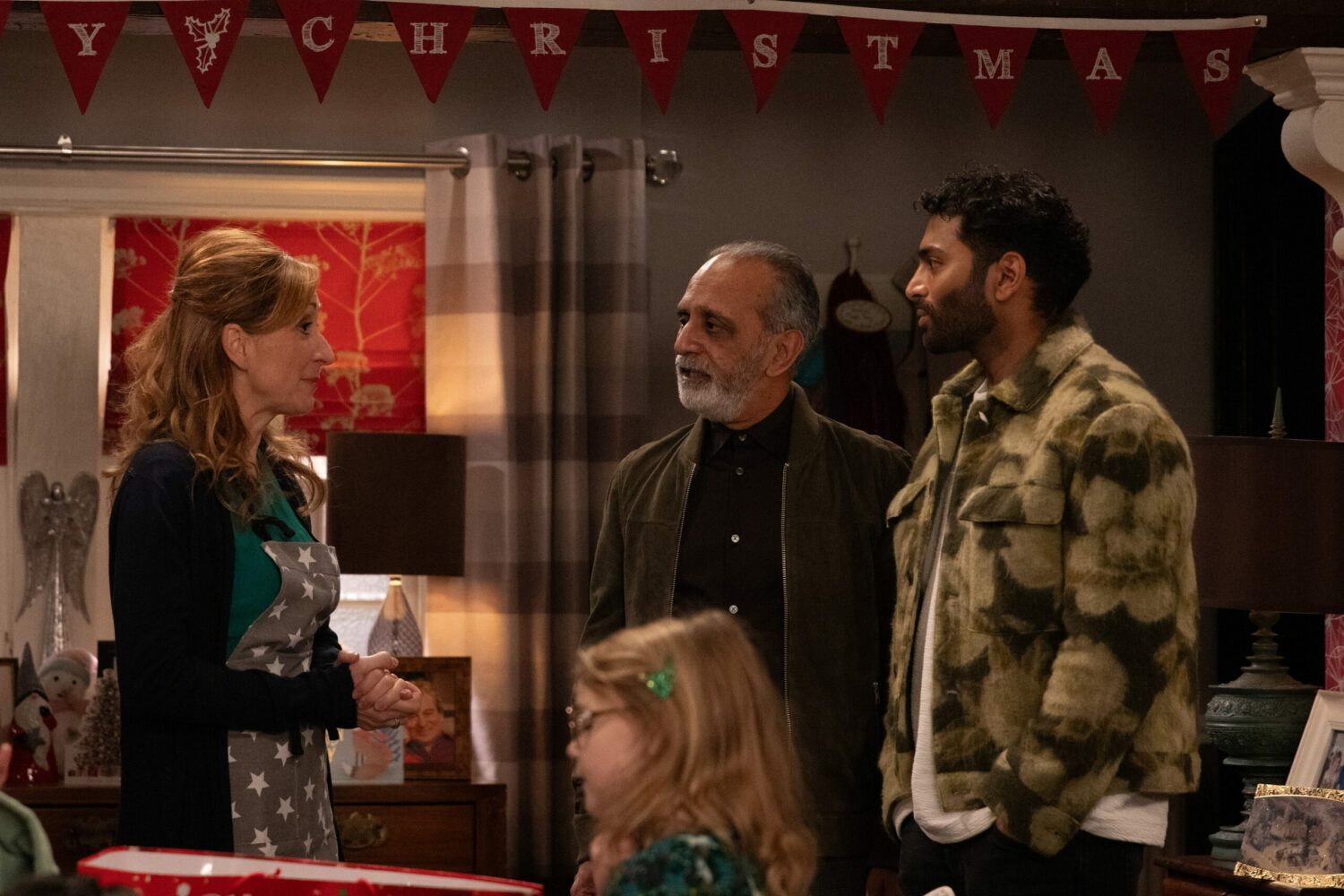 Emmerdale's Laurel, Amit and Suni are talking with Dotty next to them