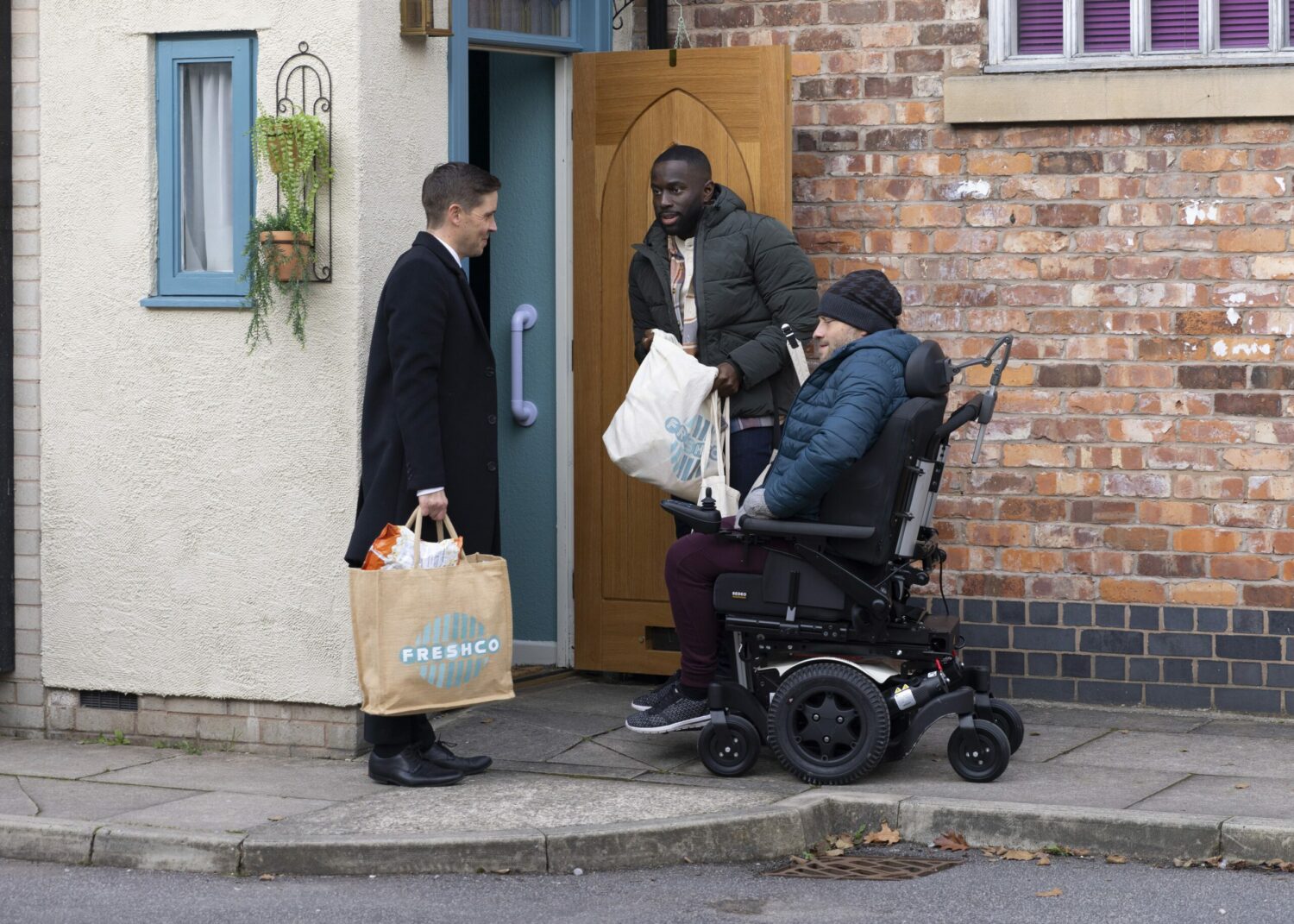 Todd clocks Moses as he's struggling to open the door after a shopping trip with Paul