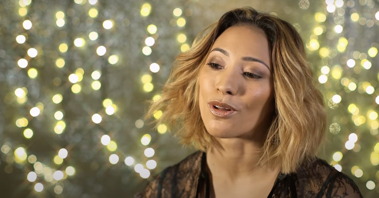 Karen Hauer against a glittery background