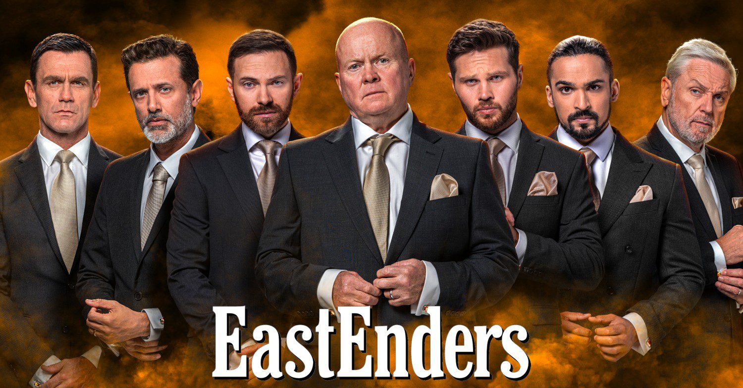 Jack Branning, Nish Panesar, Dean Wicks, Phil Mitchell, Keanu Taylor, Ravi Gulati and Rocky Cotton make up the EastEnders Seven surrounded by orange smoke with EastEnders logo