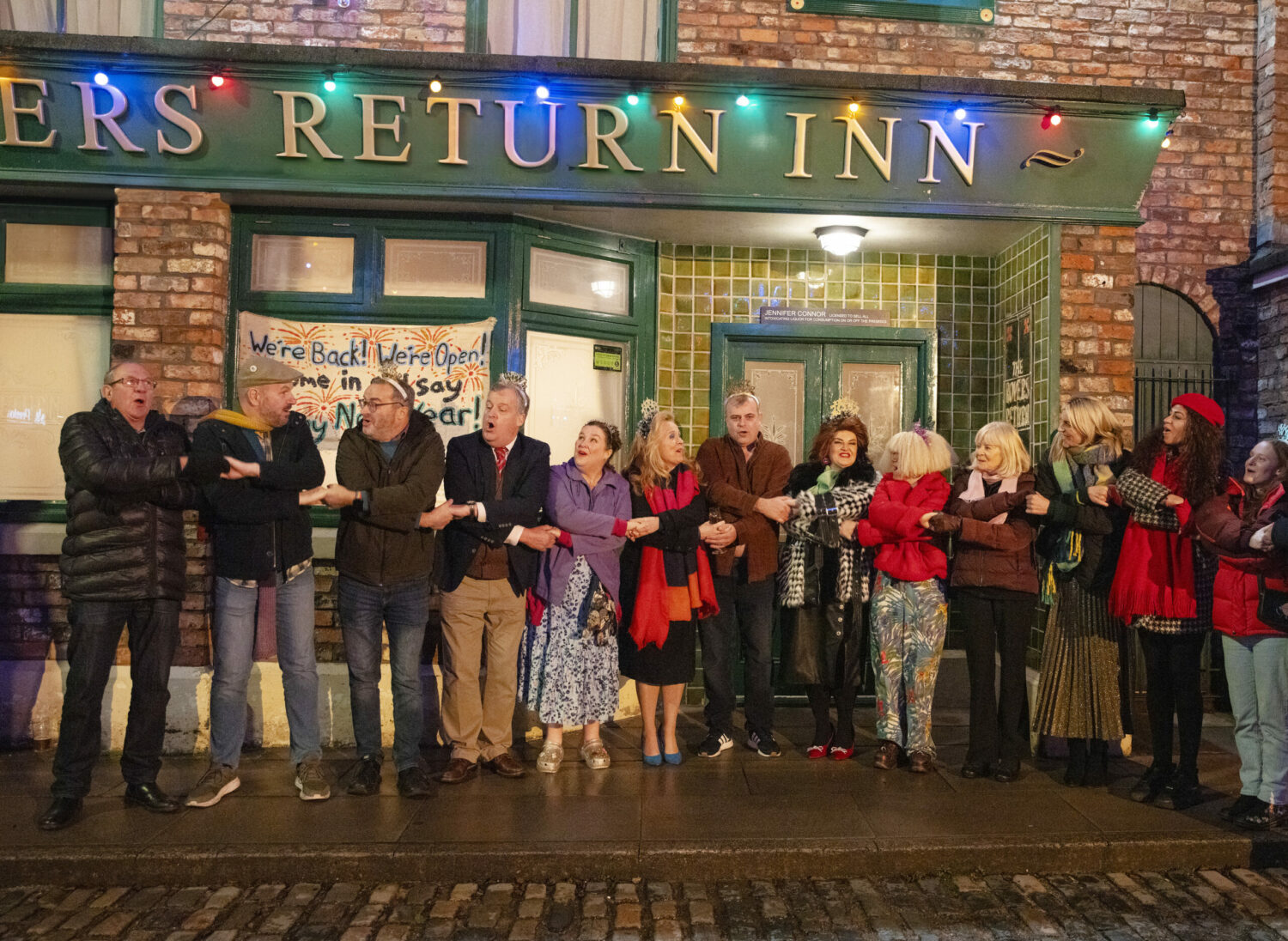 Jenny Connor [SALLY-ANN MATTHEWS] and Daisy look proudly on as the locals muck in and prepare the pub for the grand reopening.