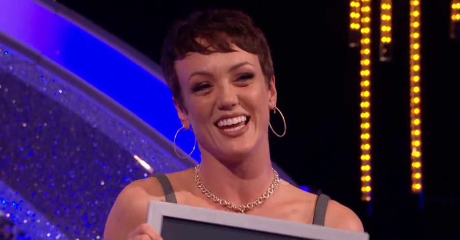 Lauren Oakley holding world record certificate