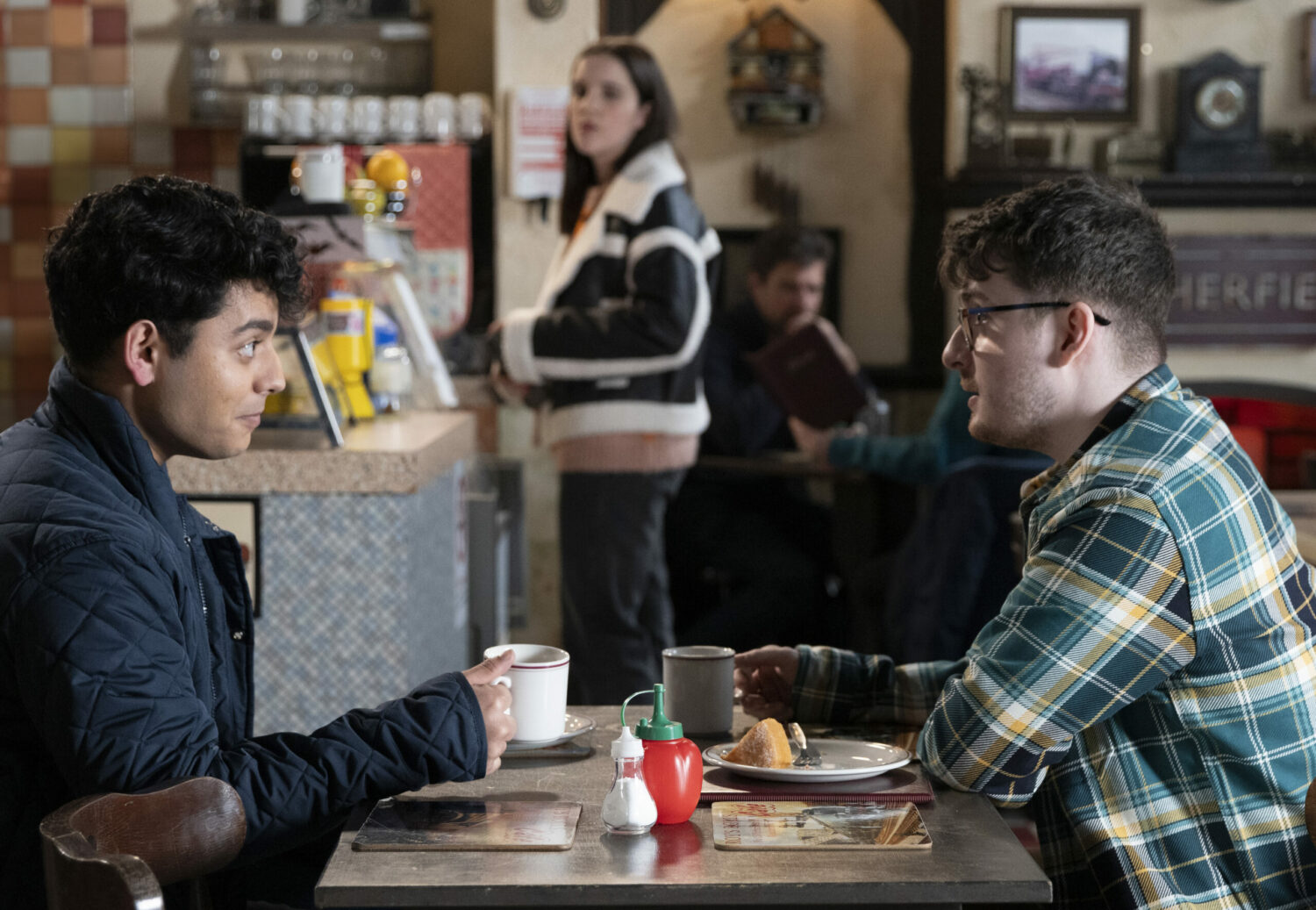 Aadi talks to Bobby on Corrie while Amy looks on