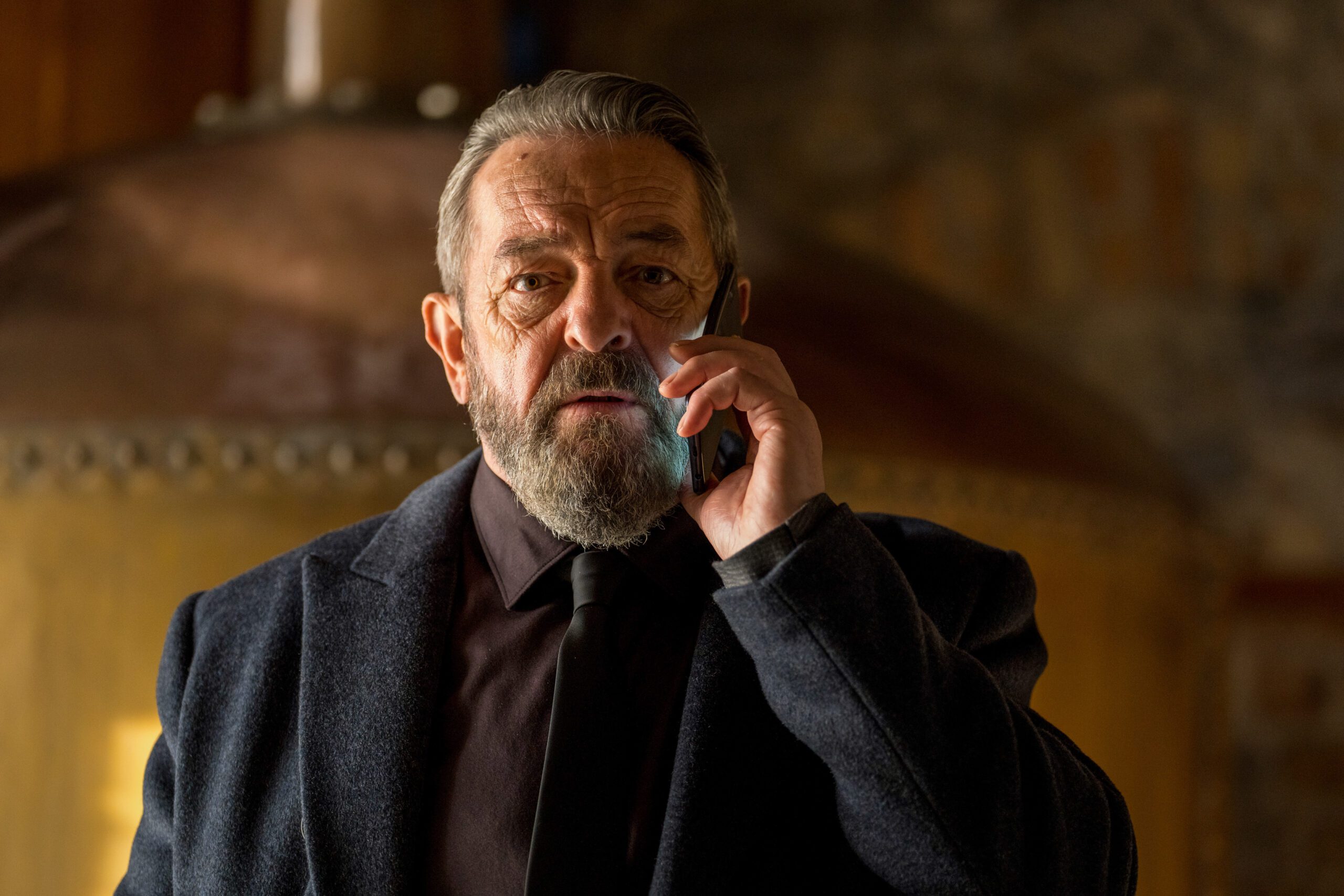 Francis Magee on phone in character as Frank in The Tourist series 2