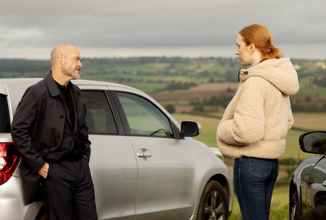 Emmerdale's Harry and Chloe are talking outside of a parked car