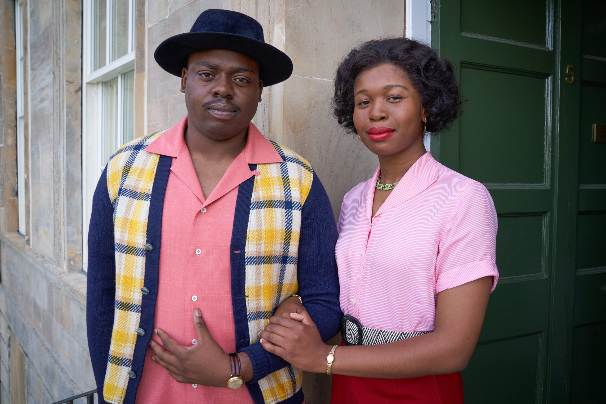 Demmy Ladipo (right) as Jimmy Amaike and Ngozi Ude (left) as Gloria Obianyo in BBC One's Murder is Easy