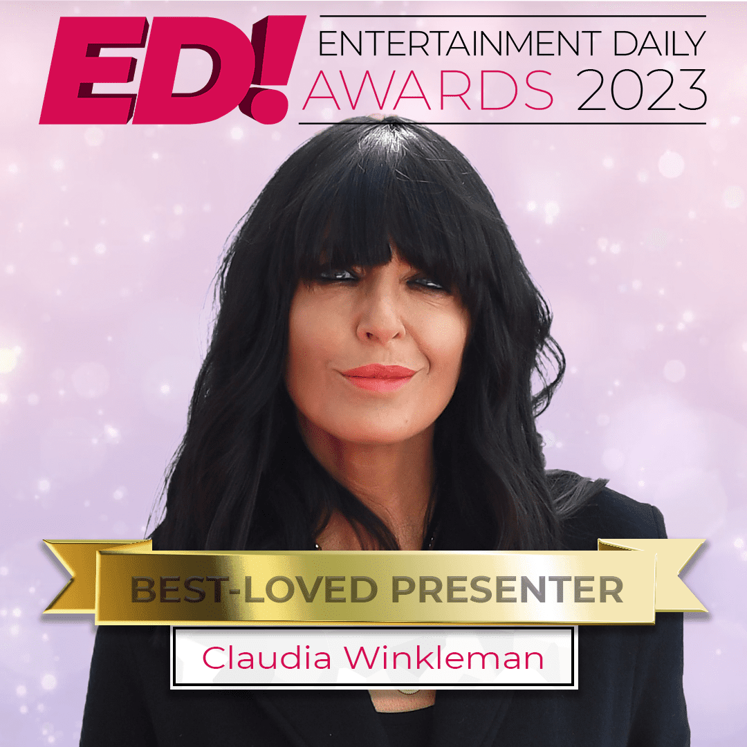 Claudia Winkleman with red lipstick against a pink background