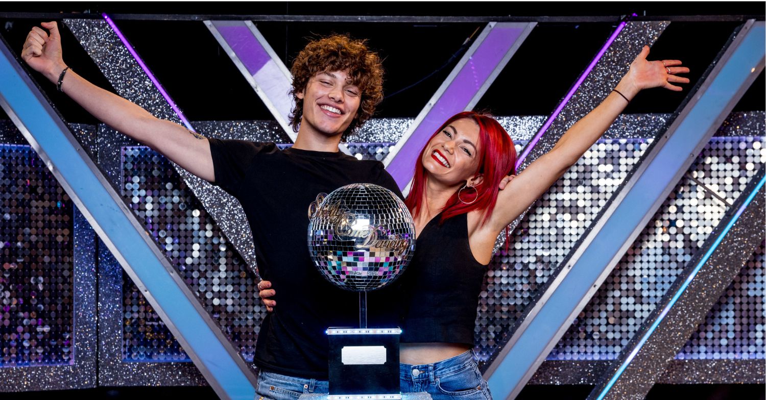 Bobby Brazier and Dianne Buswell posing with glitterball trophy