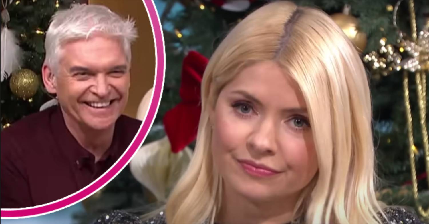 Holly looks unimpressed, Phil smiles