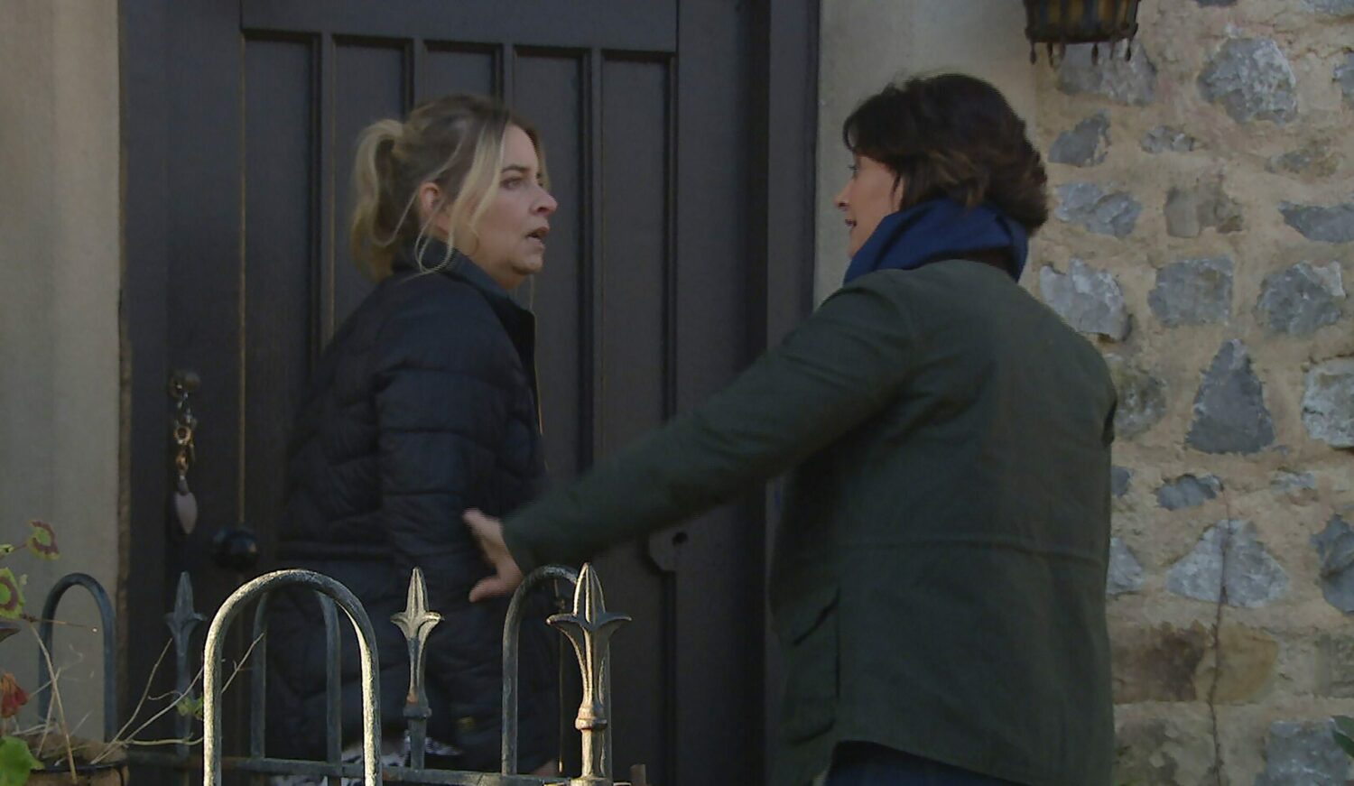 Charity Dingle looks shocked as Moira Dingle grabs her arm