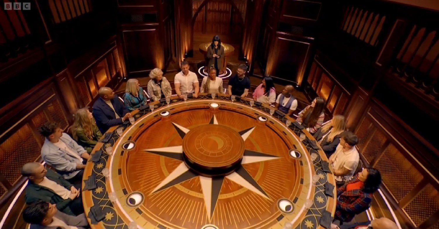 The Traitors players sat around the table 