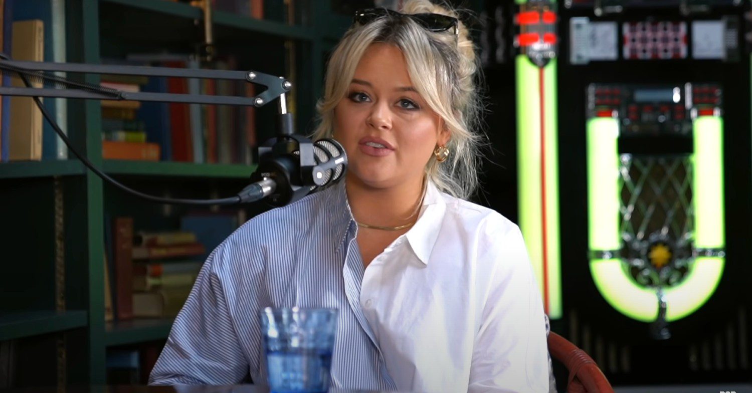 Emily Atack doing a podcast