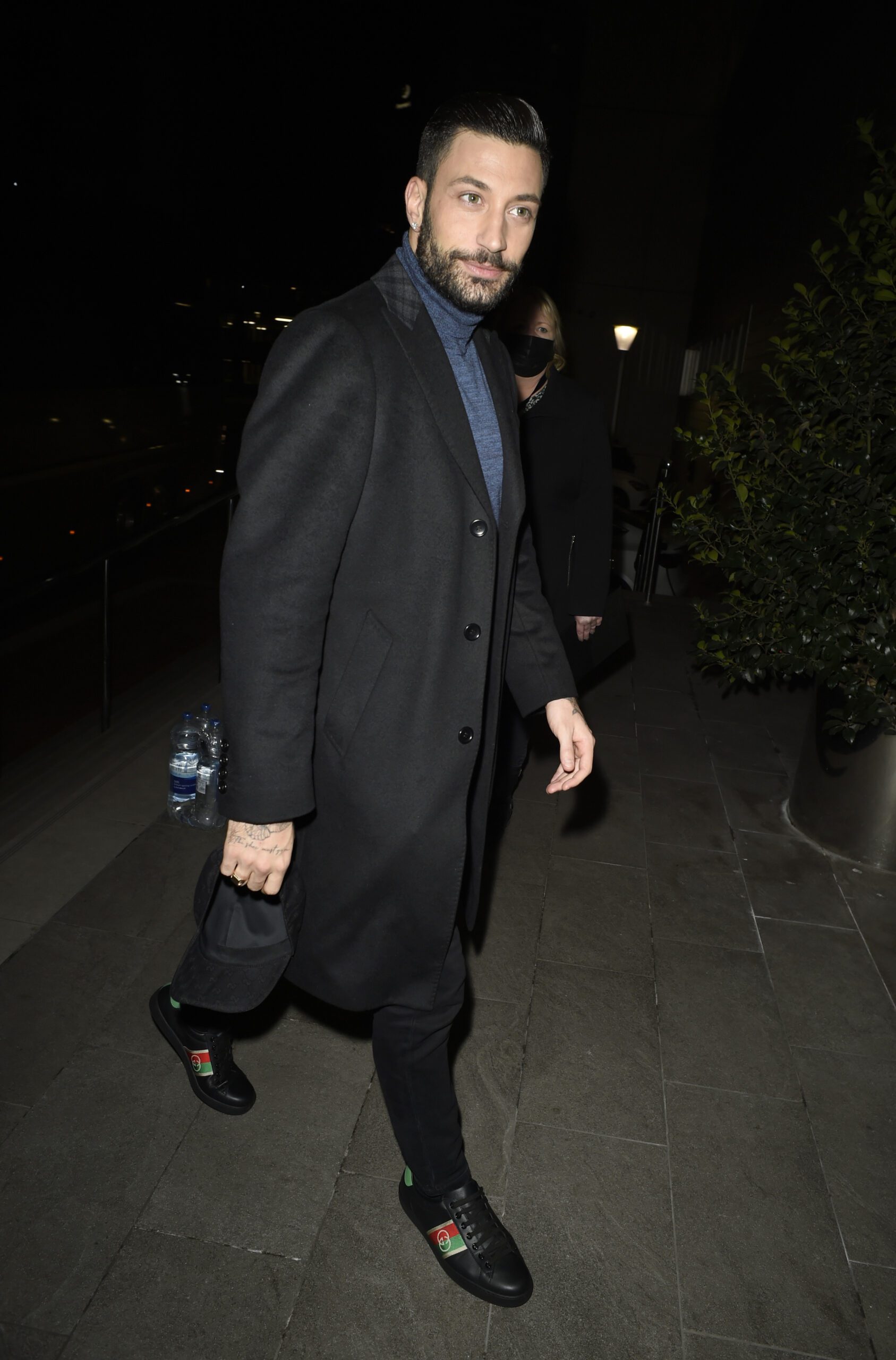 Giovanni Pernice from Strictly in a long black coat