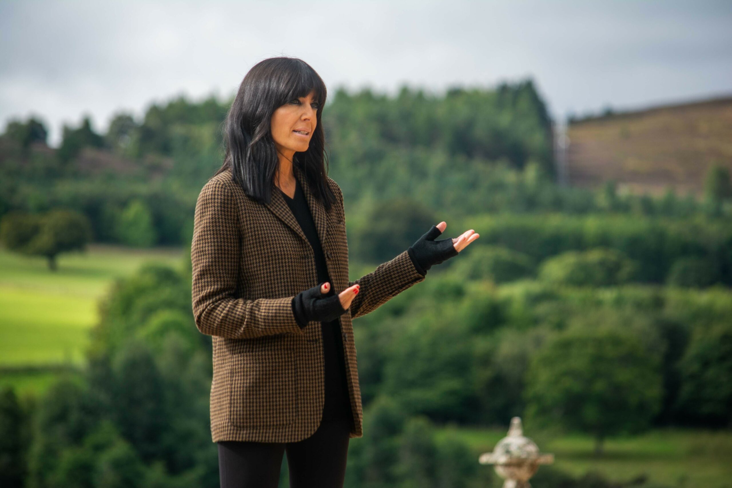 Claudia Winkleman presenting The Traitors